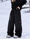 Pantalon de snowboard cargo ample et extensible pour femme, style freestyle, en tissu Techline utilitaire et résistant.