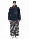Pantalon de ski ample et décontracté pour homme, en polaire sherpa synthétique zippée et genoux renforcés.