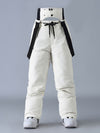 Salopette de ski SnowPeak StormGuard pour femme, isolée et résistante aux intempéries.