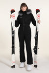 Combinaison de ski une pièce chic à capuche en fourrure pour femme, haute performance.