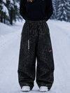 Pantalon de snowboard cargo ample et extensible pour femme, style freestyle, en tissu Techline utilitaire et résistant.