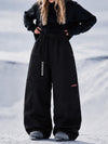 Pantalon de snowboard cargo ample et extensible pour femme, style freestyle, en tissu Techline utilitaire et résistant.