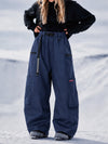Pantalon de snowboard cargo ample et extensible pour femme, style freestyle, en tissu Techline utilitaire et résistant.