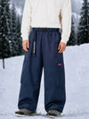 Pantalon de snowboard cargo ample et extensible pour homme, style freestyle, en tissu Techline utilitaire et résistant.