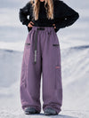 Pantalon de snowboard cargo ample et extensible pour femme, style freestyle, en tissu Techline utilitaire et résistant.