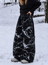 Pantalon de snowboard ample UrbanCraft pour femmes, conçu pour une mobilité accrue des genoux.