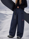 Pantalon de snowboard cargo ample et extensible pour femme, style freestyle, en tissu Techline utilitaire et résistant.