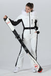 Combinaison de ski une pièce chic à capuche en fourrure pour femme, haute performance.