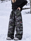 Pantalon de snowboard cargo ample et extensible pour femme, style freestyle, en tissu Techline utilitaire et résistant.