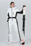 Combinaison de ski une pièce chic à capuche en fourrure pour femme, haute performance.