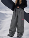 Pantalon de snowboard cargo ample et extensible pour femme, style freestyle, en tissu Techline utilitaire et résistant.