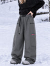 Pantalon de snowboard cargo ample et extensible pour femme, style freestyle, en tissu Techline utilitaire et résistant.