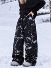 Pantalon de snowboard cargo ample et extensible pour femme, style freestyle, en tissu Techline utilitaire et résistant.