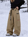 Pantalon de snowboard cargo ample et extensible pour femme, style freestyle, en tissu Techline utilitaire et résistant.