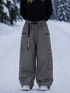 Pantalon de snowboard cargo ample et extensible pour femme, style freestyle, en tissu Techline utilitaire et résistant.