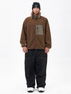 Pantalon de ski ample et zippé en polaire sherpa synthétique pour homme, avec genoux renforcés.