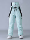 Salopette de ski SnowPeak StormGuard pour femme, isolée et résistante aux intempéries.