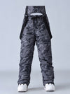 Salopette de ski SnowPeak StormGuard pour femme, isolée et résistante aux intempéries.