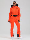 Combinaison de ski évasée Gsou Snow Mountain Chic pour femme, ornée de fausse fourrure.