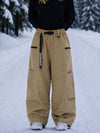 Pantalon de snowboard cargo ample et extensible pour femme, style freestyle, en tissu Techline utilitaire et résistant.