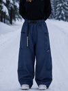 Pantalon de snowboard cargo ample et extensible pour femme, style freestyle, en tissu Techline utilitaire et résistant.