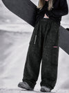 Pantalon de snowboard cargo ample et extensible pour femme, style freestyle, en tissu Techline utilitaire et résistant.